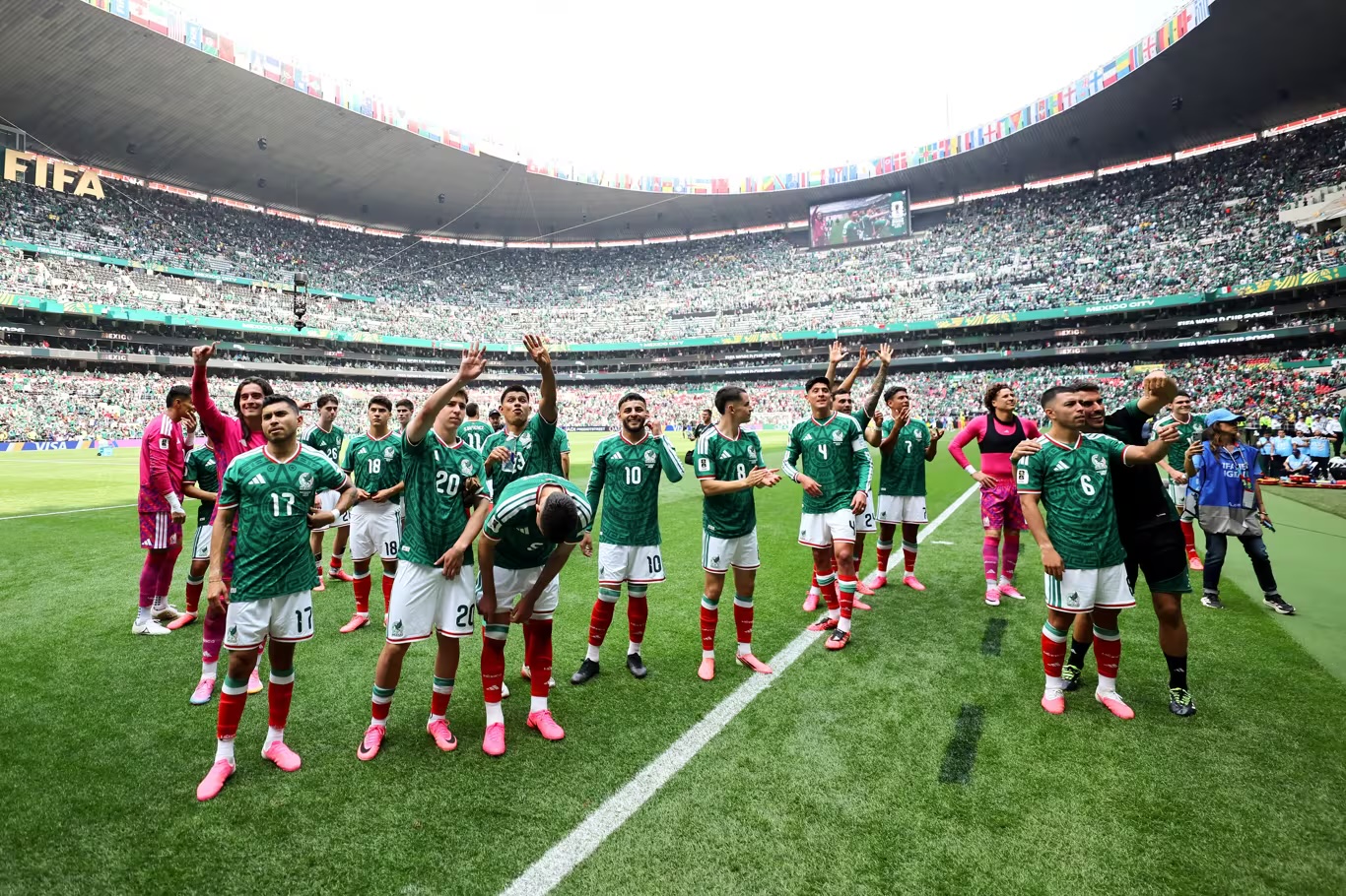 Mexico's squad salutes the Azteca crowd after the final whistle